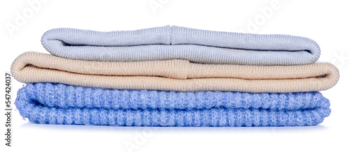 Stack of warm hats on white background isolation