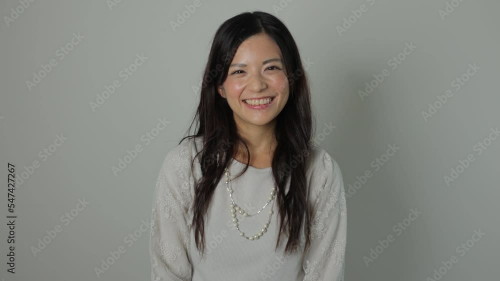 Asian beautiful woman smiles at the camera. Happy, Joy, Delighted. Dolly out. Asian beautiful woman smiles at the camera. Happy, Joy, Delighted. Dolly out.