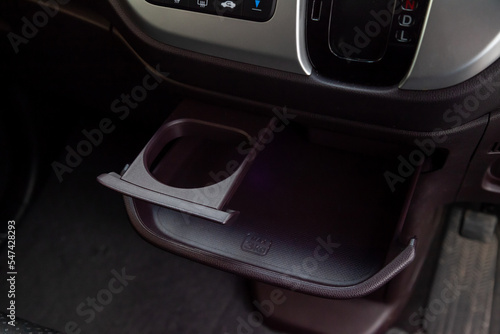 Interior view with cupholder and pocket on front panel on the kei car.