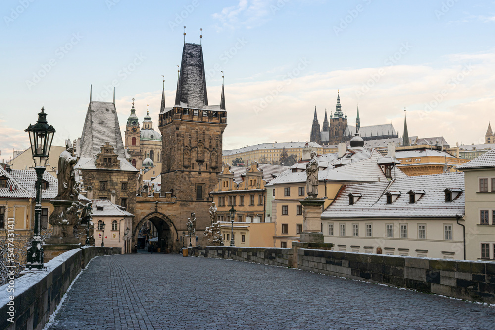First snow in Prague, Charles bridge and Prague castle