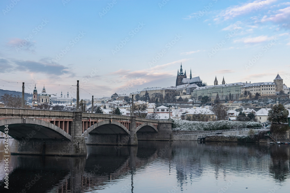 First snow in Prague, Vltava river and Prague Castle in the early winter
