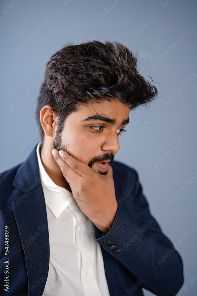 young indian business man isolated on plain, giving different poses young indian business man isolated on plain, giving different poses