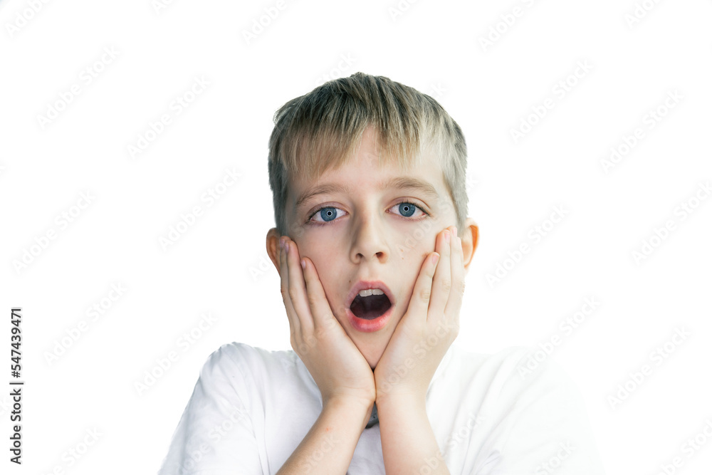 Portrait of a child on white background, surprised expression Portrait of a child on white background, surprised expression