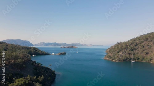 Beautiful seashore. Islands in the distance. Colorful blue sea. The beauty of Turkey. Beautiful rocks and mountains. Sunny clear day. Beautiful water.