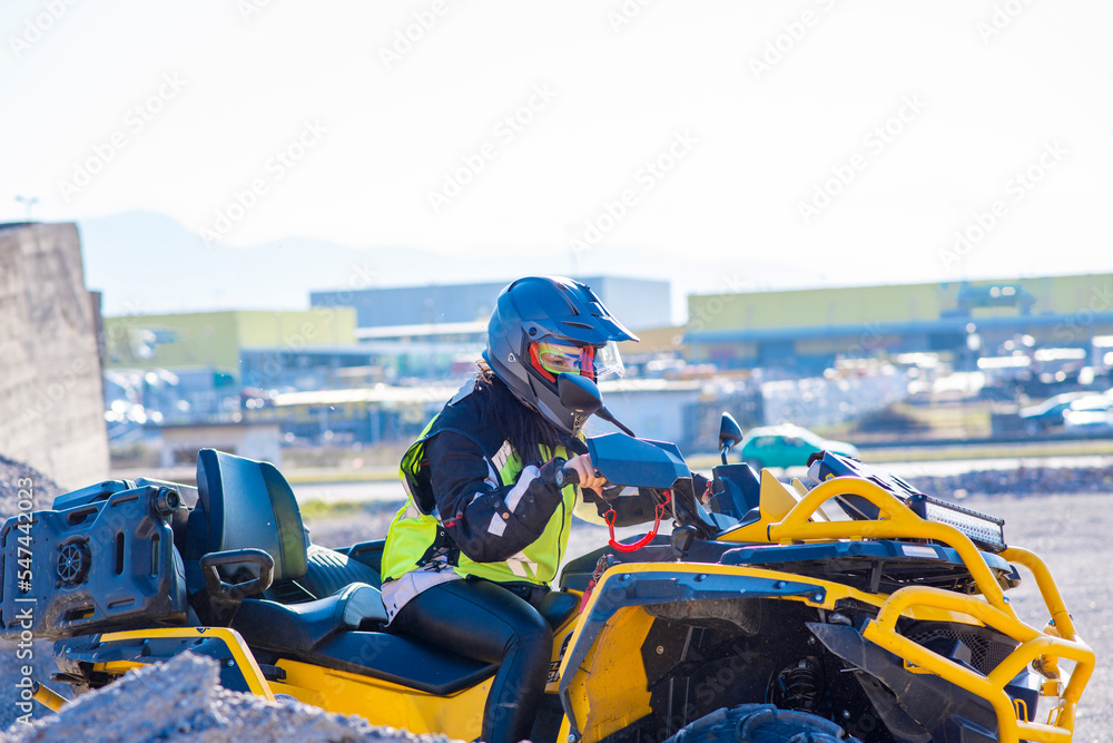 Girl driving ATV on dirt road Girl driving ATV on dirt road