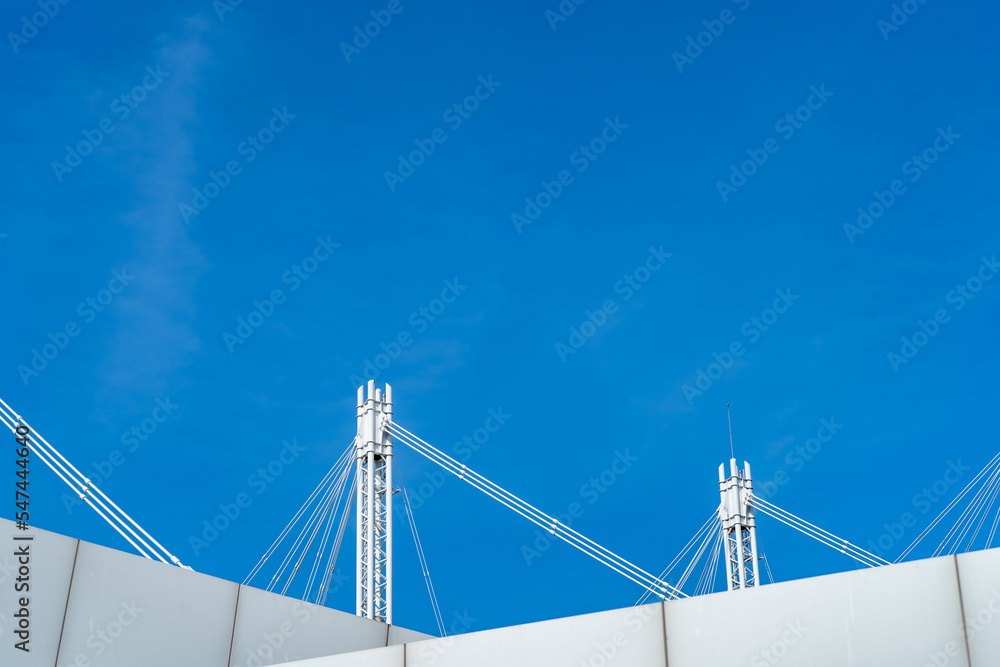 Steel white frame structure with blue sky background Steel white frame structure with blue sky background