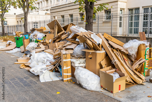 Fototapeta Naklejka Na Ścianę i Meble -  Cartons and garbage in a street during a waste collection service strike in Paris, France