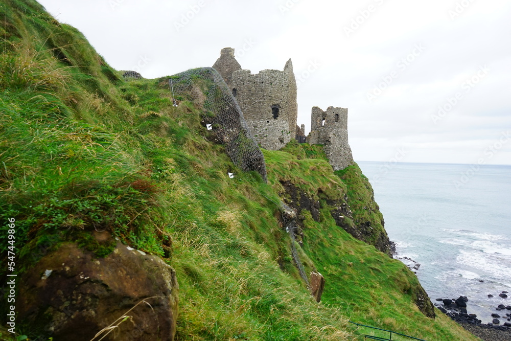 Dunluce Castle, ruined medieval castle, on Antrim Coast in Northern Ireland 