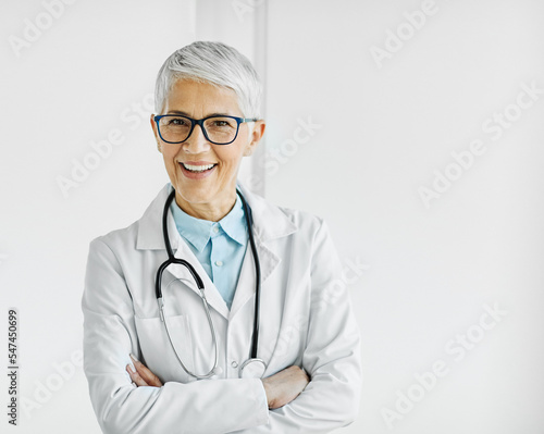 senior elderly gray hair active doctor hospital medical medicine health care clinic office portrait glasses woman stethoscope specialist © Lumos sp