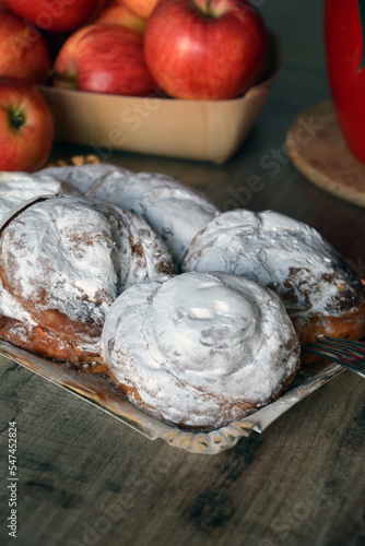 Spanish sweet bread spiral-shaped and sprinkled with powdered sugar. Perfect for breakfast. Rustic style.