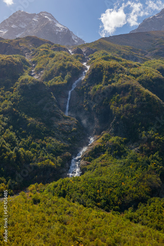 Tana glacier in North Ossetia, mountain waterfalls in the highlands.