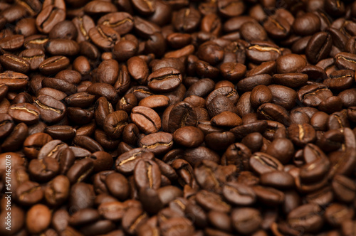 Coffee bean background. Scattered coffee beans