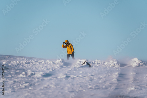 Obraz na płótnie Woman in yellow coat suffers from Icelandic winter winds w salonie