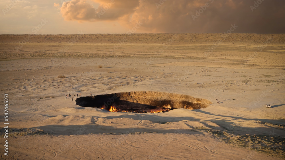 Darvaza gas crater, also known as the Gates of Hell. Panoramic view of the famous natural gas crater in Turkmenistan that is still burning, decades after the crater collapsed during the Soviet era. - obrazy, fototapety, plakaty 