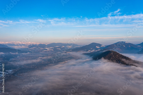 Carpathian peaks in the morning in the clouds  top view  drone footage.