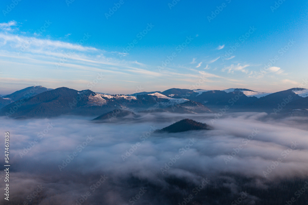 Carpathian peaks in the morning in the clouds, top view, drone footage. Carpathian peaks in the morning in the clouds, top view, drone footage.