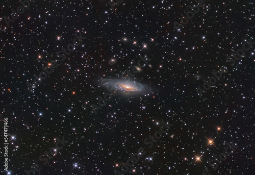 NGC 7331 galaxy in the andromeda constellation, and some stars at the background. photo