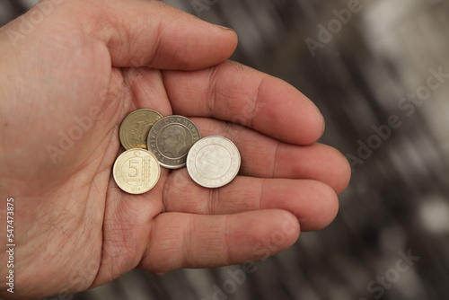 Several Turkish coins in hand photo