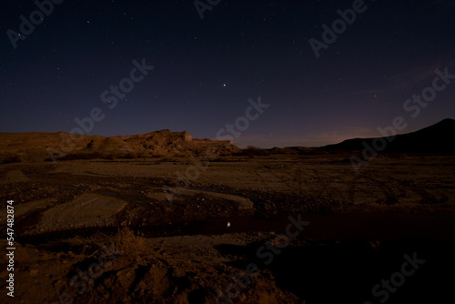 starry night in the desert reflection of Jupiter in the lake