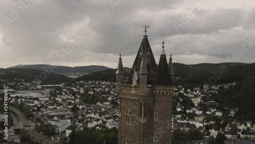 Aerial shot of the Wilhelmsturm tower in the City of Dillenburg, Germany on a clouded day photo