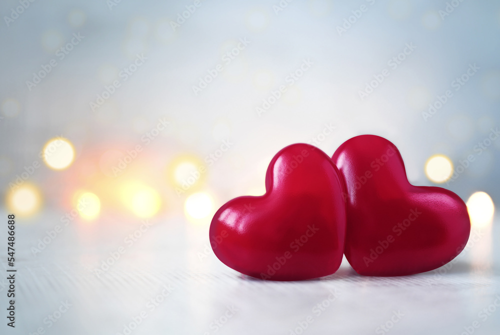 Two pink Valentine's day heart on pastel grey glitter background. Love concept, top view. Minimalism style. Two pink Valentine's day heart on pastel grey glitter background. Love concept, top view. Minimalism style.