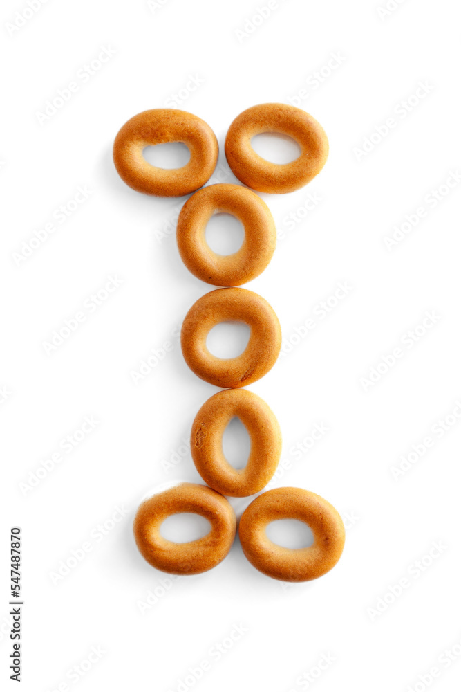Letter I bagel. Bagels font. Alphabet from set of small dry bagels isolated on white background. ABC symbols.