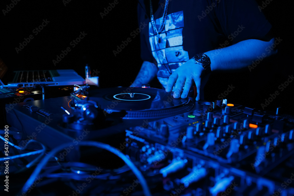 Hip hop dj scratching records on turntables. Disk jokey scratches vinyl