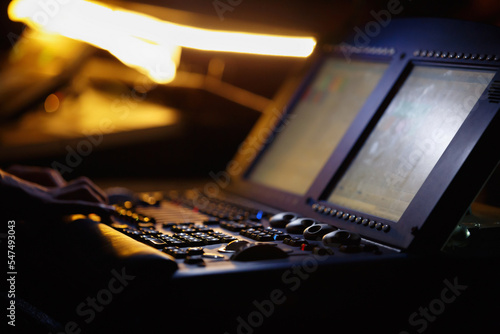Stage lighting controller in night club. Professional light technician panel on concert