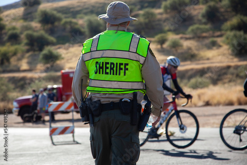 A local sheriff directing traffic at an event