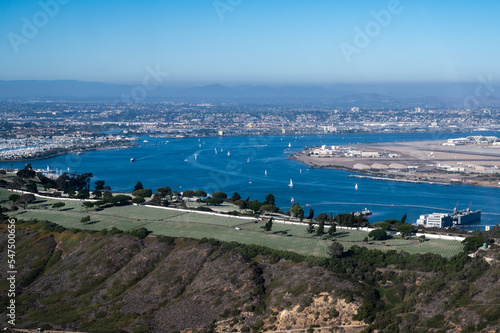 Aerial view of Fort RoseCrans cemetery in San Diego California with Coronado military base and sailboats in the background photo
