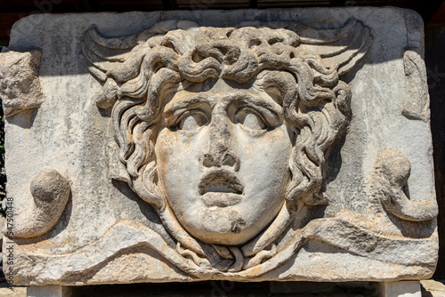 Detail of stone carved Medusa head in Apollo Temple, Didim, Didyma, Aydin, Turkey. The famous Medusa figure, one of the symbols of Didim.