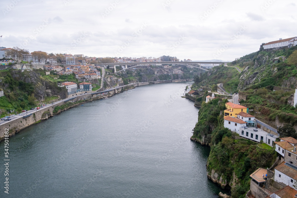 Porto, Portugal: November 13 2022. View of Douro river from Dom Luis I Bridge in a cloudy day