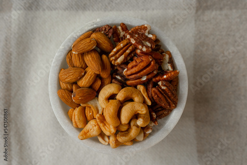 Mix Walnuts, pecan, almonds, cashews on a beautiful stand, Healthy Nuts.
