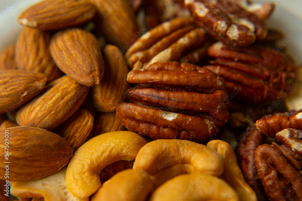 Mix Walnuts, pecan, almonds, cashews on a beautiful stand, Healthy Nuts. Mix Walnuts, pecan, almonds, cashews on a beautiful stand, Healthy Nuts.