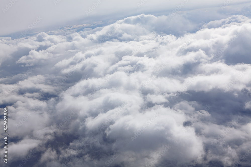 Snow white clouds . Above fluffy cloudscape Snow white clouds . Above fluffy cloudscape