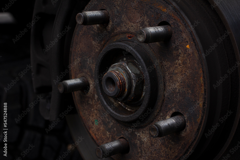 Car brake discs and rusted brake bolts. Restoration of brake discs. Tire maintenance Car brake discs and rusted brake bolts. Restoration of brake discs. Tire maintenance