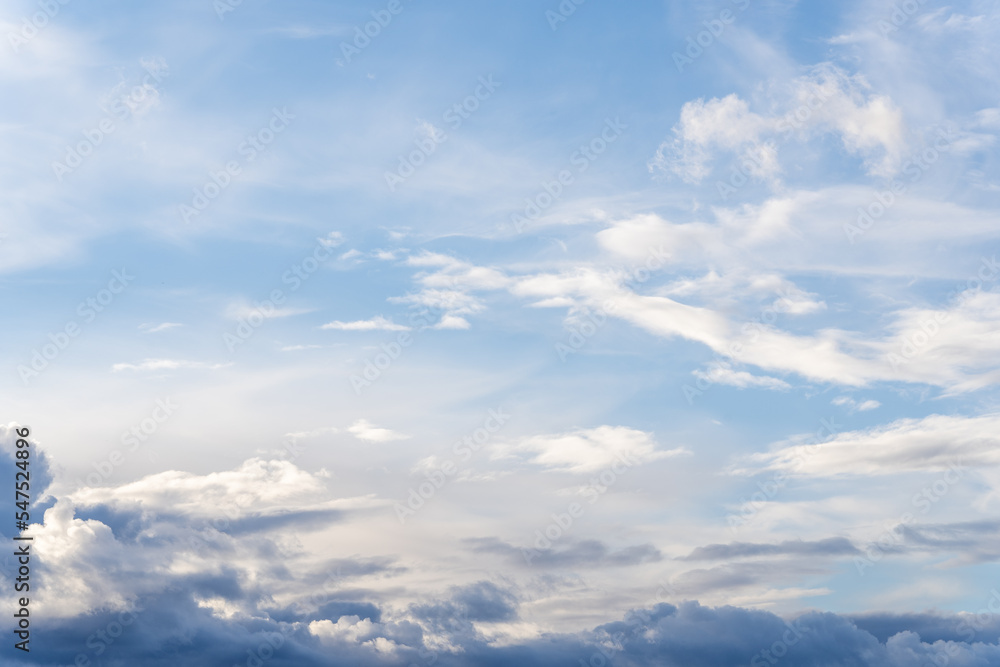 A beautiful blue autumn sky with white fluffy clouds makes for a fabulous overall view of the sky A beautiful blue autumn sky with white fluffy clouds makes for a fabulous overall view of the sky