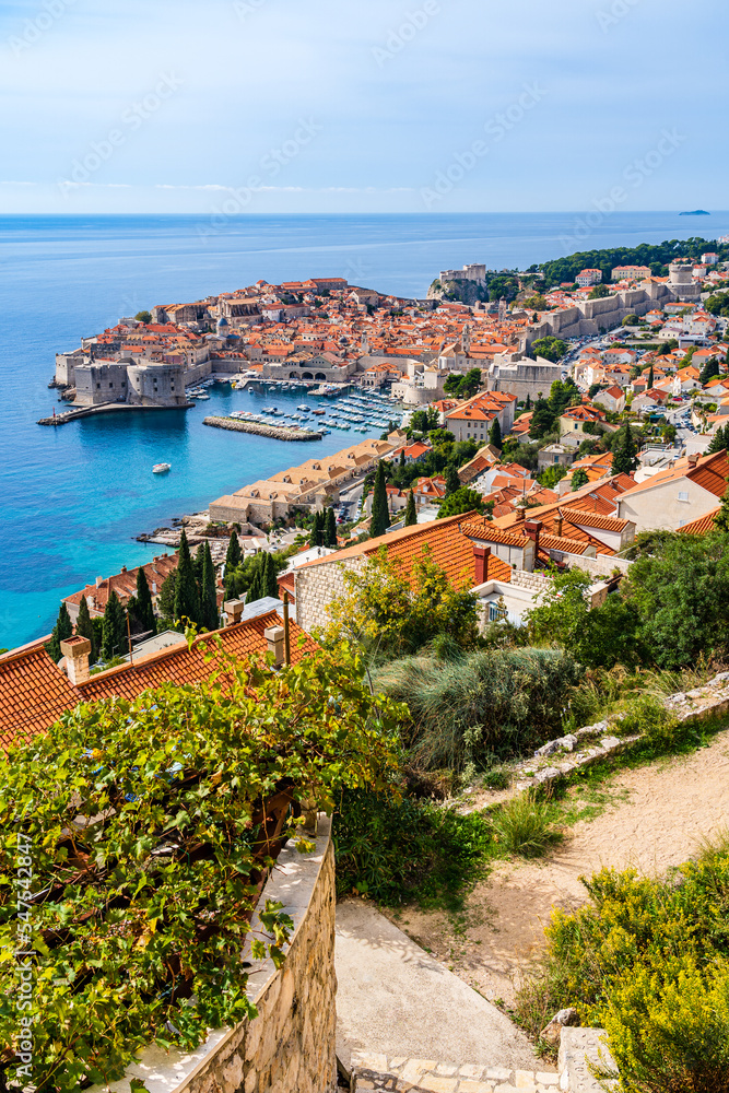Dubrovnik, Croatia: Aerial panoramic view of the old town and old harbor on the shores of the Adriatic Sea; Croatian Mediterranean riviera