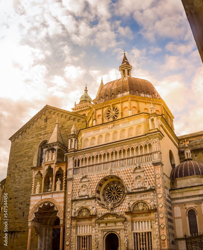 Facade of the Basilica of Santa Maria Maggiore in Bergamo Alta, at dusk. 