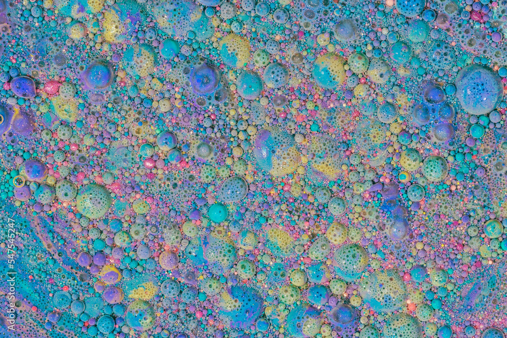 Multicolored paints create a beautiful abstract background