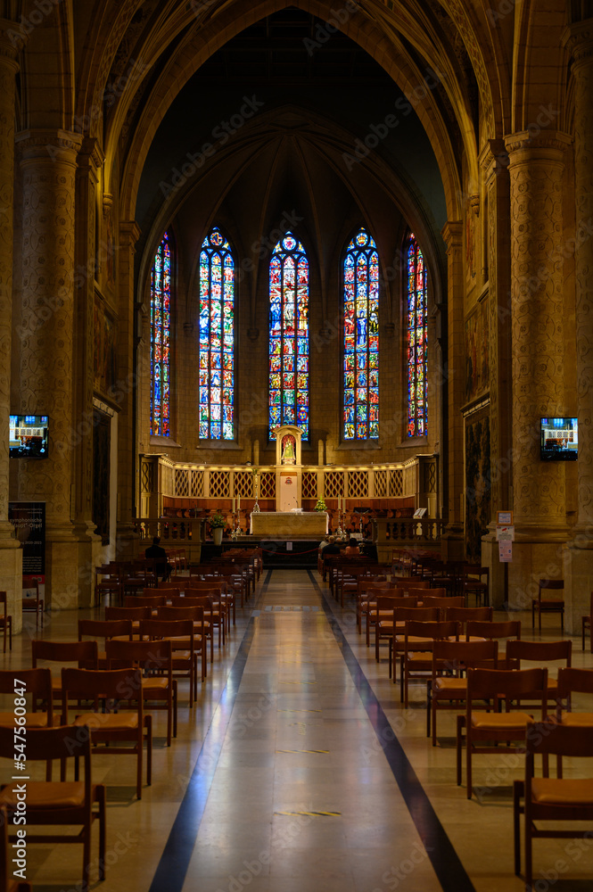 Obraz premium The central altar and stained-glass windows above it in the Notre-Dame de Luxembourg (the Notre-Dame Cathedral in Luxembourg).