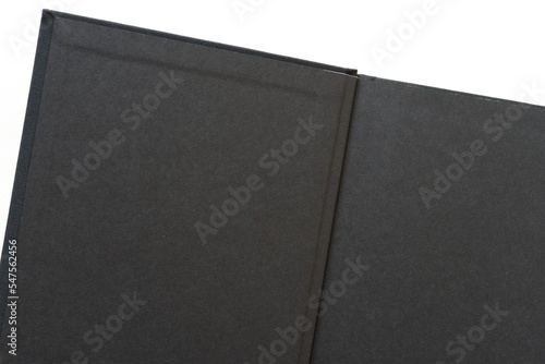 open hardcover book with black endpapers