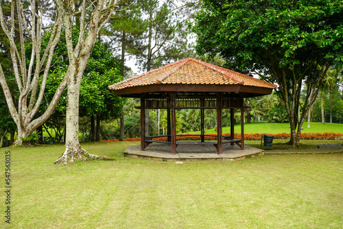 A gazebo for rest and shelter in a very large garden of grass and flowers. Thriving meadow. Taman Bunga Nusantara  Cianjur  West Java  Indonesia.