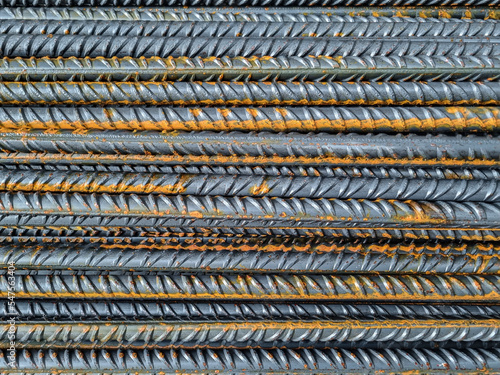 Metal iron bars stracked on building construction site, high prices work materials crisis