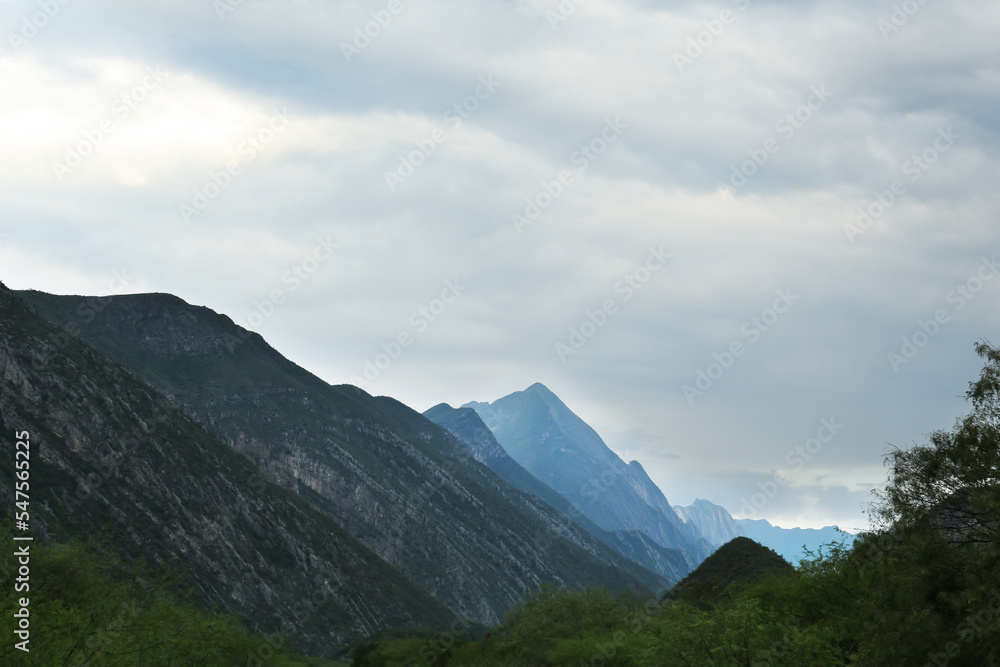 Fototapeta premium Picturesque landscape with high mountains under gloomy sky outdoors