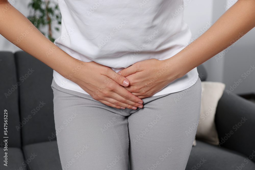 Woman suffering from cystitis at home, closeup Woman suffering from cystitis at home, closeup