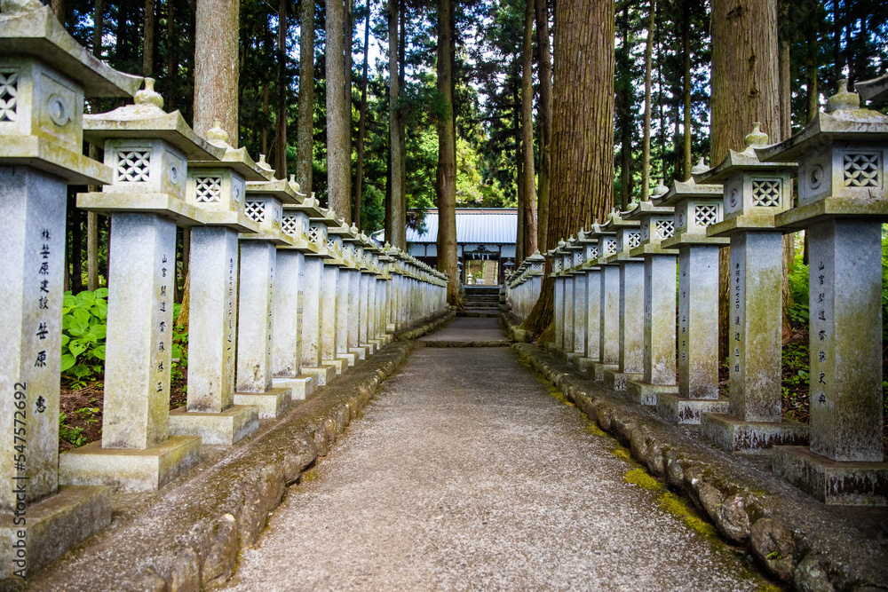 Japanese stone toro lanterns at shrine entrance Japanese stone toro lanterns at shrine entrance