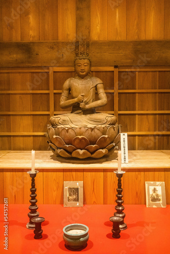 Old Buddha wooden statue in Murayama Sengen Shrine ancient building photo