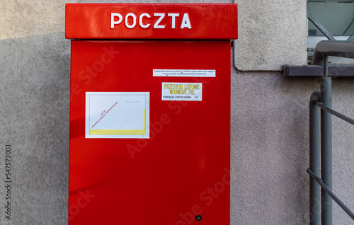Red post box in Poland. Typical polish post symbol