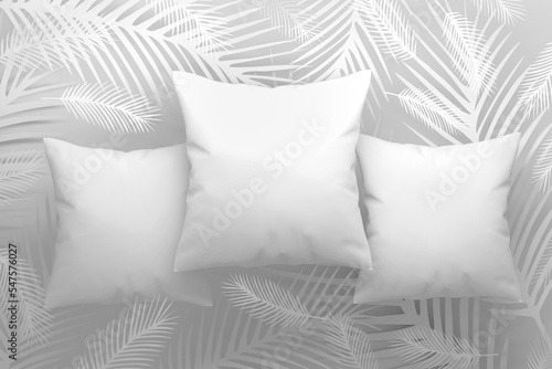 Mockup template with three pillows with blank surfces and feathers photo